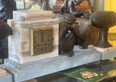 Marbel Lady Resting on clock.